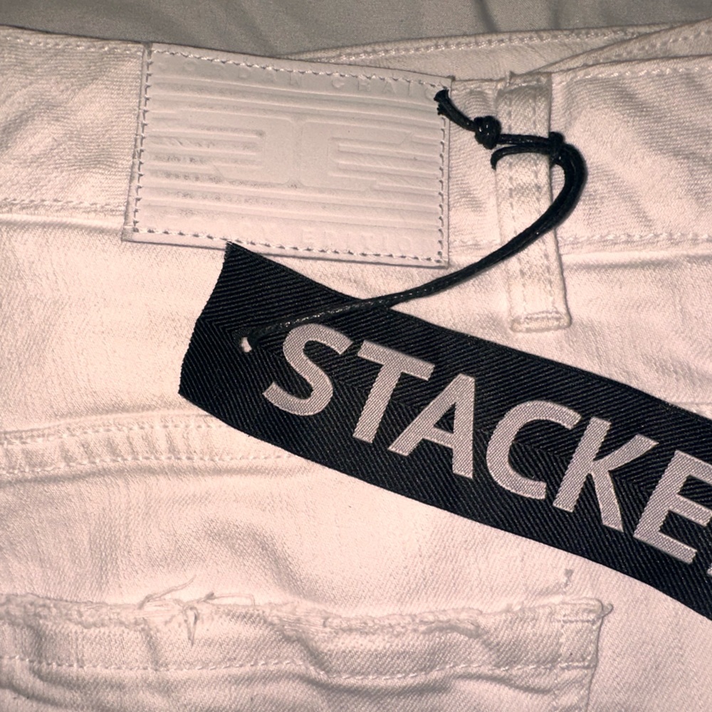 Jordan Craig White stacked Jeans with Red Lettering